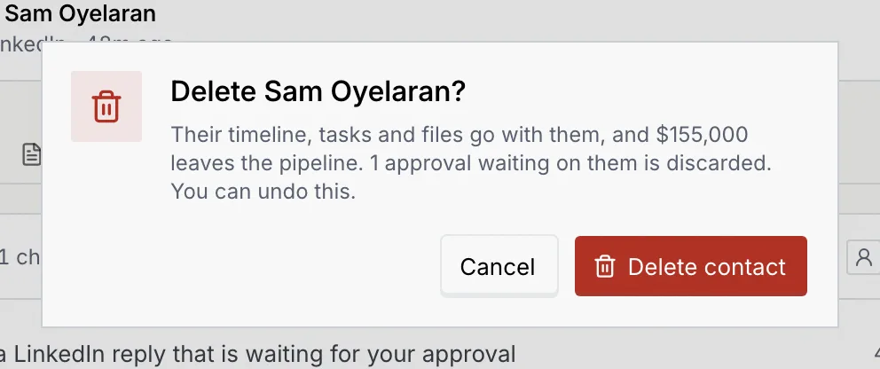 The Delete Sam Oyelaran? confirmation: their timeline, tasks and files go with them, $155,000 leaves the pipeline, 1 approval waiting on them is discarded, with Cancel and Delete contact