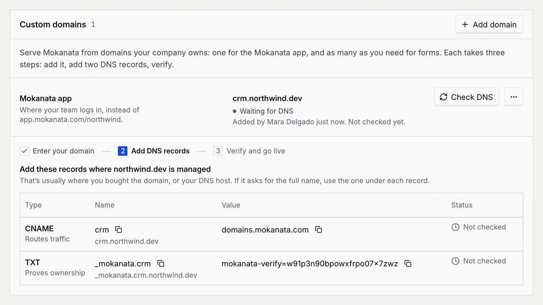 The domain crm.northwind.dev waiting for DNS, with the setup steps and the CNAME and TXT records to add, both Not checked