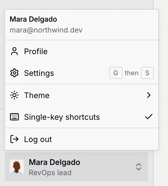 The account menu above Mara Delgado's name, with Profile, Settings (G then S), Theme, Single-key shortcuts checked and Log out