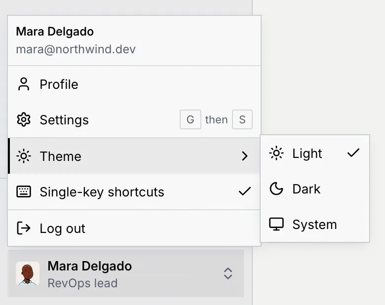 The account menu with the Theme submenu open, showing Light (checked), Dark and System
