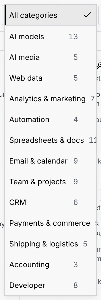 The category filter open: All categories, AI models 13, AI media 5, Web data 5, Analytics & marketing 7, Automation 4, Spreadsheets & docs 11, Email & calendar 9, Team & projects 9, CRM 6, Payments & commerce 9, Shipping & logistics 5, Accounting 3, Developer 8